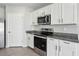 Close up on the kitchen, featuring stainless steel appliances and granite counter tops at 2604 Knight Island Dr, Brandon, FL 33511