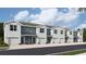 View of the new two-story townhomes featuring attached garages and contemporary design at 2744 Newbern Banks Dr, Bradenton, FL 34208