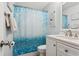 Charming bathroom featuring decorative shower curtain and modern fixtures at 2799 Wesleyan Dr, Palm Harbor, FL 34684