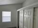 Bright bedroom features a window and closet with sliding doors at 3110 N Massachusetts Ave, Tampa, FL 33603