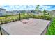 Outdoor basketball court with black chainlink fence for neighborhood fun and recreation at 3192 King Fern Dr, Wimauma, FL 33598