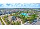 Aerial view of community featuring a playground and community pool with ample green space at 3192 King Fern Dr, Wimauma, FL 33598