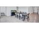 Dining room featuring a large table with seating for eight, tiled floors and neutral wall paint at 3192 King Fern Dr, Wimauma, FL 33598