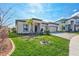 Charming single-story home featuring a spacious three-car garage and a well-manicured lawn at 3192 King Fern Dr, Wimauma, FL 33598