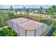 Outdoor pickleball court with black chainlink fence for neighborhood fun and recreation at 3192 King Fern Dr, Wimauma, FL 33598