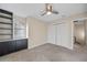 Bedroom with neutral walls and carpet, a ceiling fan and closet at 3203 W San Carlos St, Tampa, FL 33629