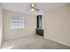 Bedroom with neutral walls and carpet, a ceiling fan and built in shelving at 3203 W San Carlos St, Tampa, FL 33629