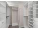 Walk-in closet with built-in shelving and ample storage space for clothes and accessories at 3203 W San Carlos St, Tampa, FL 33629