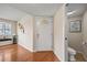 Home foyer featuring hardwood floors, sidelight windows, and a half bath at 3203 W San Carlos St, Tampa, FL 33629