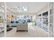 Bright and airy living room featuring large windows, skylight and stylish furniture at 3203 W San Carlos St, Tampa, FL 33629