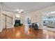 Living room featuring hardwood floors, a fireplace, and multiple doorways to other rooms at 3203 W San Carlos St, Tampa, FL 33629