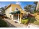 Home exterior with a sunroom featuring ample windows and sliding glass doors at 3203 W San Carlos St, Tampa, FL 33629