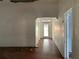 View of the living room with hardwood floors and interior entry door at 3208 N 15Th St, Tampa, FL 33605