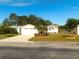 Charming single-story home features a well-manicured lawn and a two-car garage at 37027 Lakota Ct, Zephyrhills, FL 33542