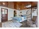 Cozy bedroom showcasing a spiral staircase, skylight, wood ceiling, and modern ensuite bathroom at 468 11Th N Ave, St Petersburg, FL 33701