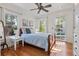 Light-filled bedroom with hardwood floors, backyard views, and a comfortable bed at 468 11Th N Ave, St Petersburg, FL 33701