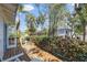 Cozy outdoor deck with wood flooring and a partial view of the surrounding foliage and neighborhood at 468 11Th N Ave, St Petersburg, FL 33701