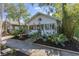 Charming home featuring a cozy front porch, mature landscaping, and a well-manicured lawn at 468 11Th N Ave, St Petersburg, FL 33701