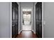 Bathroom featuring a soaking tub, modern chandelier, and black closet doors at 5292 Kernwood Ct, Palm Harbor, FL 34685