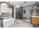 Bathroom featuring a soaking tub, walk-in shower, and patterned tile floors at 5292 Kernwood Ct, Palm Harbor, FL 34685