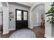 Inviting foyer with a hardwood floor, featuring a decorative rug, and a view into a dining room at 5292 Kernwood Ct, Palm Harbor, FL 34685