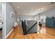 Hallway with wood floors and neutral gray walls leading to other rooms in the home at 5292 Kernwood Ct, Palm Harbor, FL 34685