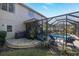 Relaxing screened-in pool area with stylish patio furniture, perfect for outdoor entertaining at 5292 Kernwood Ct, Palm Harbor, FL 34685