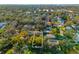 Aerial view showcasing a home nestled among lush trees at 5714 S 1St St, Tampa, FL 33611