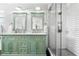 Elegant bathroom with double vanity and walk-in shower at 5714 S 1St St, Tampa, FL 33611