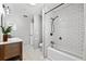 Bathroom with white subway tile shower, hexagon floor tile and a freestanding tub at 5714 S 1St St, Tampa, FL 33611