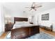 Bright bedroom featuring a king-size bed and ceiling fan at 5714 S 1St St, Tampa, FL 33611