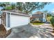 Detached gray garage with white door at 5714 S 1St St, Tampa, FL 33611