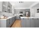 Modern kitchen with gray cabinets and white quartz countertops at 5714 S 1St St, Tampa, FL 33611