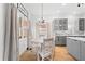 Bright kitchen with breakfast nook and gray shaker cabinets at 5714 S 1St St, Tampa, FL 33611