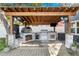 Pergola-covered outdoor kitchen and grill at 5714 S 1St St, Tampa, FL 33611