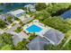 Beautiful aerial view of community pool with hot tub and surrounding neighborhood homes at 5940 Pelican Bay S Plz # Ph E, Gulfport, FL 33707