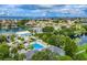 Stunning aerial view of neighborhood homes, water views, and community pool at 5940 Pelican Bay S Plz # Ph E, Gulfport, FL 33707