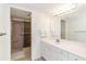 White bathroom with a vanity, a shower stall with pink tiles, and an illuminated mirror at 5940 Pelican Bay S Plz # Ph E, Gulfport, FL 33707