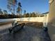 Private backyard featuring a patio, white fence, and green wicker furniture at 6113 Freeport Dr, Spring Hill, FL 34606