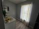 Bright bathroom featuring a modern vanity, sunflower accents, and soft, natural lighting from the window at 6113 Freeport Dr, Spring Hill, FL 34606