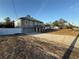 Two-story home with arched windows, two-car garage, long driveway, and well-manicured lawn at 6113 Freeport Dr, Spring Hill, FL 34606