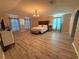 Large main bedroom with wood floors, a ceiling fan, and ample natural light at 6113 Freeport Dr, Spring Hill, FL 34606