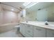 Bathroom featuring a large mirror, double vanity, and bathtub at 6171 Bahia Del Mar Blvd # 116, St Petersburg, FL 33715