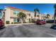 Inviting condominium exterior with mature palm trees, and well-maintained landscaping at 6171 Bahia Del Mar Blvd # 116, St Petersburg, FL 33715