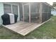 Backyard wooden deck area with outdoor grill and porch at 6483 43Rd N Ave, Kenneth City, FL 33709