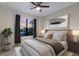 Cozy bedroom featuring neutral tones, a comfortable bed, and modern ceiling fan at 706 Acacia Ct, Bradenton, FL 34212