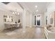 Bright dining room with modern chandelier and stylish furniture at 706 Acacia Ct, Bradenton, FL 34212