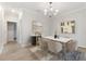 Dining room with contemporary chandelier and marble table at 706 Acacia Ct, Bradenton, FL 34212