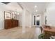 Inviting foyer with wood-look tile floors and elegant decor at 706 Acacia Ct, Bradenton, FL 34212