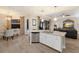 Open concept kitchen and dining area with stainless steel dishwasher at 706 Acacia Ct, Bradenton, FL 34212